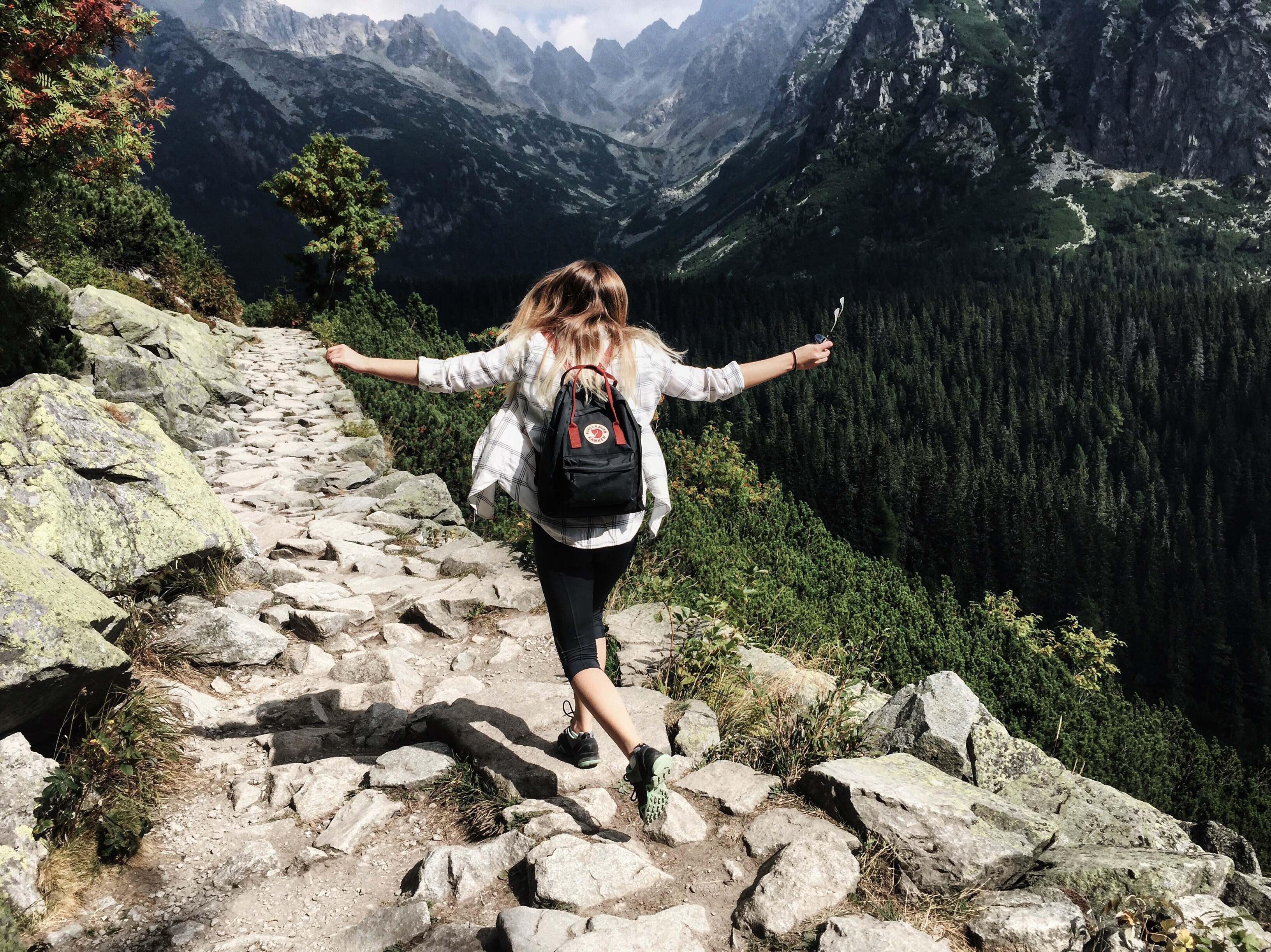Image: Young Woman hiking in mountains